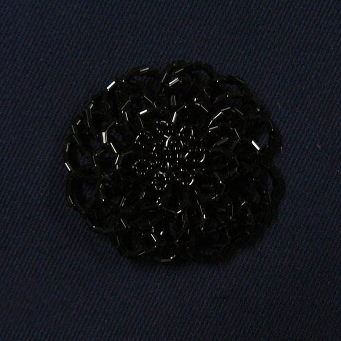 Foto de flor canutillo rocalla negro